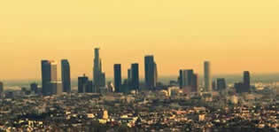 Image: a metropolitan area covered in a haze of smog.