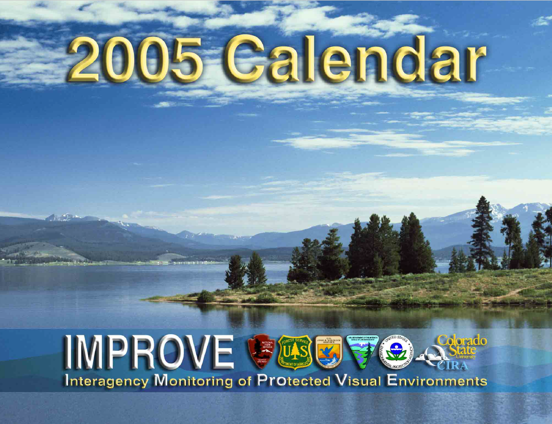 Image: photo of a large lake ringed by mountains and forest.